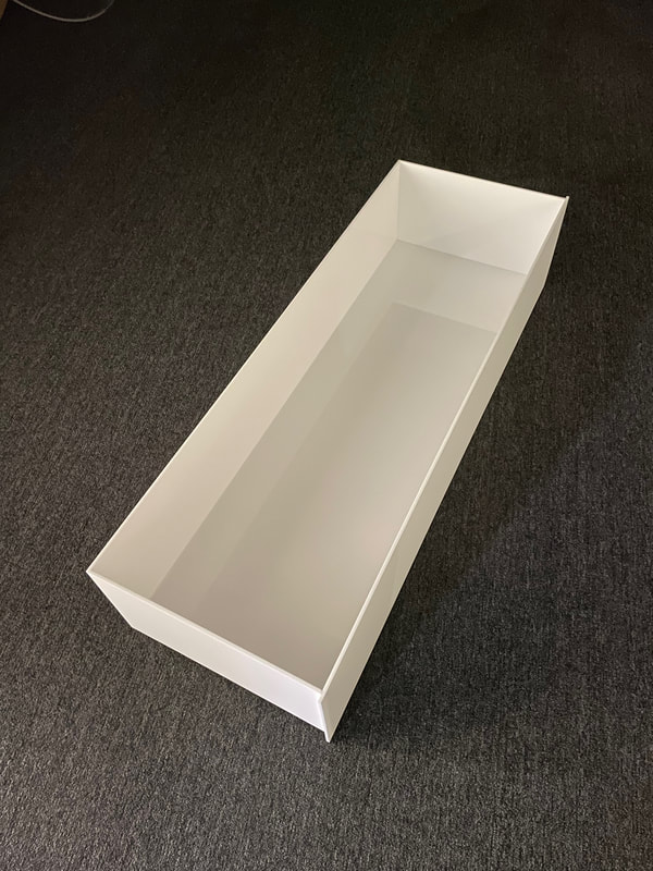 White frosted acrylic drawer.